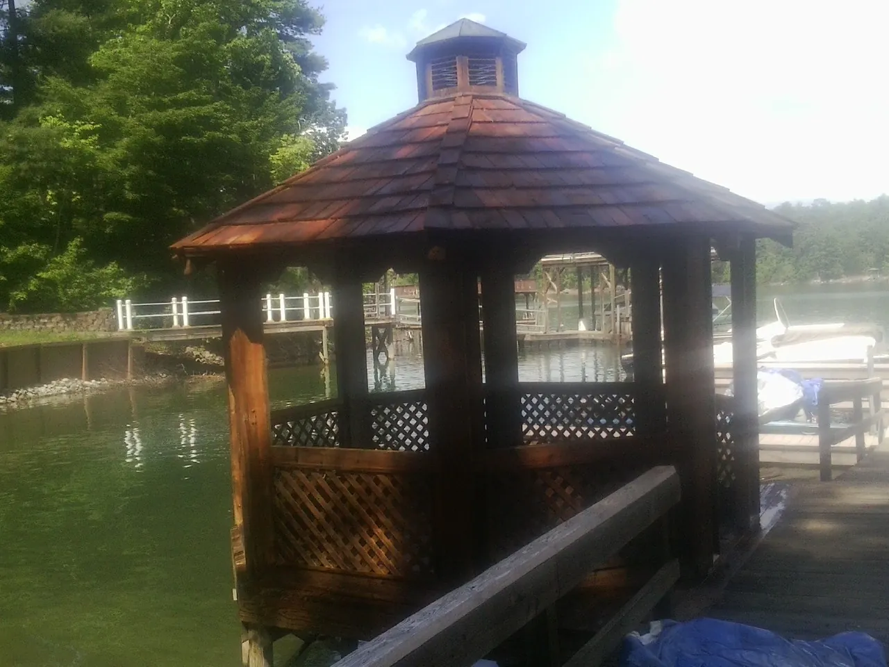 Cedar shake gazebo roof rebuilt on a lake dock in Dallastown
